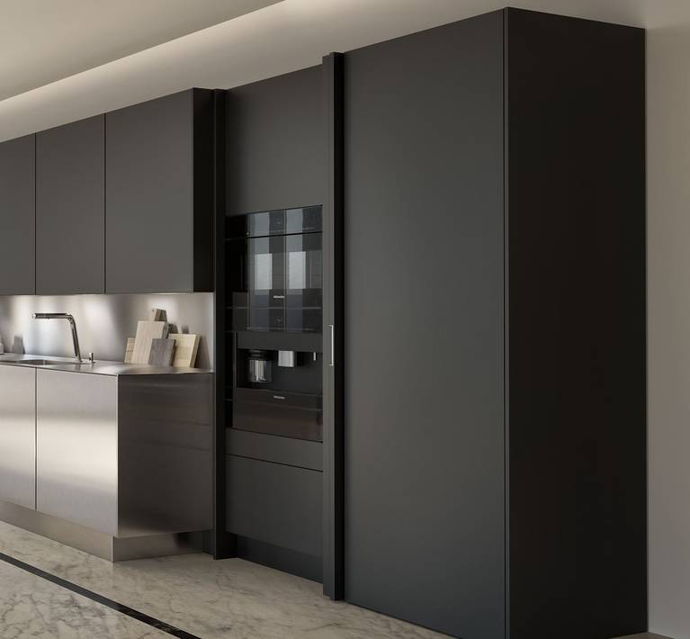 Kitchen appliances can hide behind retractable pocket doors by SieMatic.